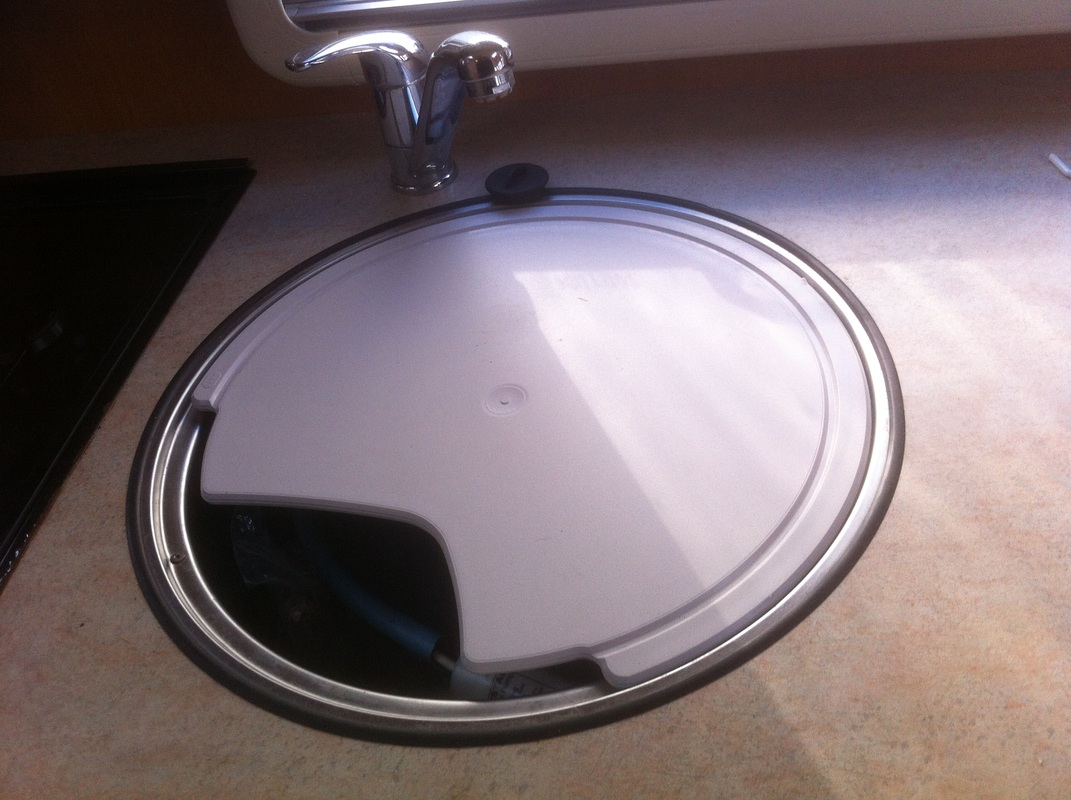 Circular caravan kitchen sink with lift off lid